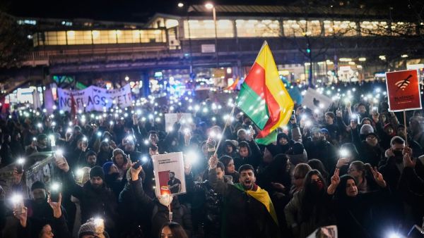 Protesters participate in a demonstration in support of the nationwide mass protests in Iran against the government, in Berlin, Germany, Wednesday, Jan. 14