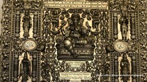 The bride and groom's names are engraved at the centre, surrounded by elephants scattering flowers