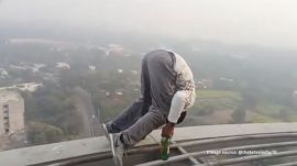 The man was carrying a bag containing beer bottles and a can, which he used during the stunt