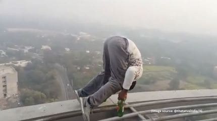 The man was carrying a bag containing beer bottles and a can, which he used during the stunt