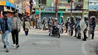 Policemen in riot gear stand guard in Birgunj, 130 kilometers (81miles) south of Katmandu, Nepal, Monday. (AP Photo)