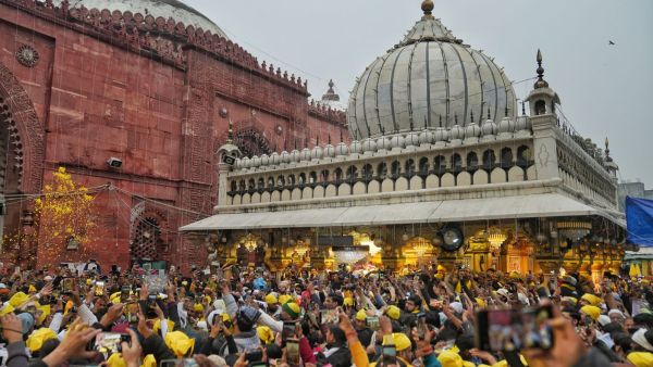 On Basant Panchami, Nizamuddin Dargah turned yellow as devotees offered flowers and qawwalis marked the arrival of spring through faith and music. (Express Photo)