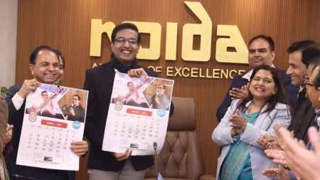 NMRC calendar features IAS officer Lokesh M in two April photographs showing him playing the sitar and addressing an event (Express)