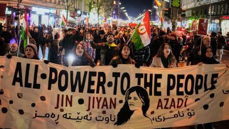 Protesters participate in a demonstration in support of the nationwide mass protests in Iran against the government, in Berlin, Germany, Wednesday, Jan. 14, 2026. (AP Photo)