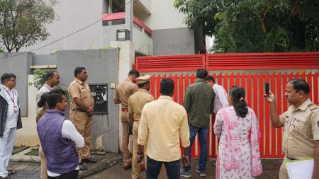 Police and people gatehred outside Puja Khedkar's house