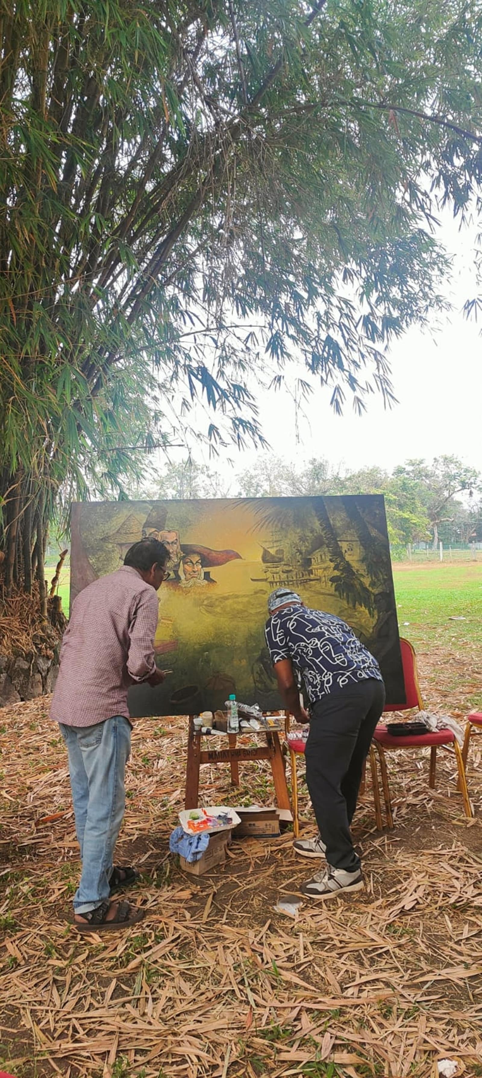 Artists putting final touches to a painting depicting cross-cultural encounters at the International Spice Routes Conference in Kochi on Tuesday