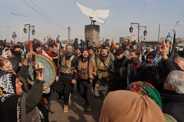 Kurdish fighters with the Syrian Democratic Forces (SDF) are cheered by local residents ahead of the end of a four-day truce with the Syrian government in Hassakeh, northeastern Syria, Saturday, Jan. 24, 2026. 