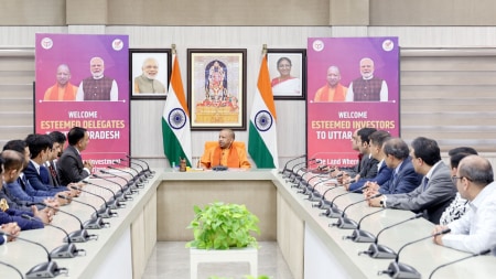 The image shows the UP chief minister Yogi in a board meeting