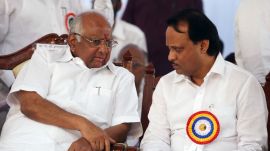 NCP Chief Sharad Pawar offering chair nearest to Maharashtra deputy chief minister Ajit Pawar at opening of Mahanand Dairy's aseptic packing section at Goregaon east on Friday. Express photo by Vasant Prabhu.15-02-2013. Mumbai