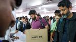 Mumbai: Polling officials collect EVMs and other election material at a distribution centre, a day before Brihanmumbai Municipal Corporation (BMC) elections, in Mumbai, Wednesday, Jan. 14, 2026. (PTI Photo)(PTI01_14_2026_000579B)
