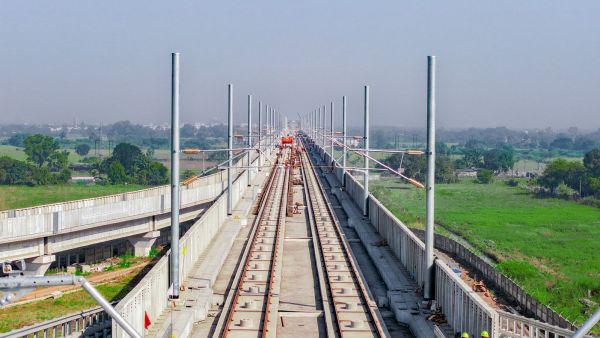 Installation of OHE masts (Image: NHSRCL)