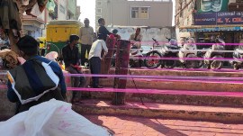 Kite-string spool makers at work in Ahmedabad’s Dilli Darwaza area