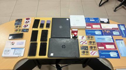 Officials seized 24 mobile phones, 51 SIM cards, two pen drives, multiple bank statements, and several rubber stamps of different business entities during the raids.