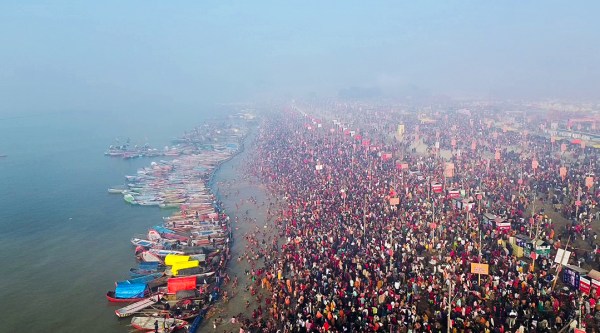 Devotees gather in large numbers at the Magh Mela Kshetra to take a holy dip at Sangam, on the occasion of Mauni Amavasya, in Prayagraj on Sunday. (ANI Photo)