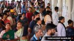 Citizens check for their names in the voter list before casting their votes for BMC election, at Dharavi Transit Camp Municipal school, in Mumbai on 15 January.