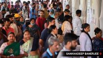 Citizens check for their names in the voter list before casting their votes for BMC election, at Dharavi Transit Camp Municipal school, in Mumbai on 15 January.