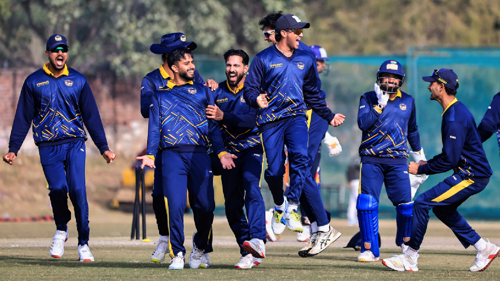 Punjab players celebrate the wicket of Mumbai's Onkar Tarmale during the Vijay Hazare Trophy 2025-26 cricket match between Mumbai and Punjab, at Jaipuria Vidyalaya Ground, in Jaipur, Thursday, Jan. 8, 2026. (PTI Photo)