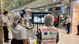 In this photograph provided by the public relations department of the Suvarnabhumi International Airport, Quarantine doctors watch thermal scanning of travelers from west Bengal, India at the Suvarnabhumi International Airport in Samut Prakarn, Thailand, on Sunday, Jan. 25, 2026. (Public relations department of Suvarnabhumi International Airport via AP)