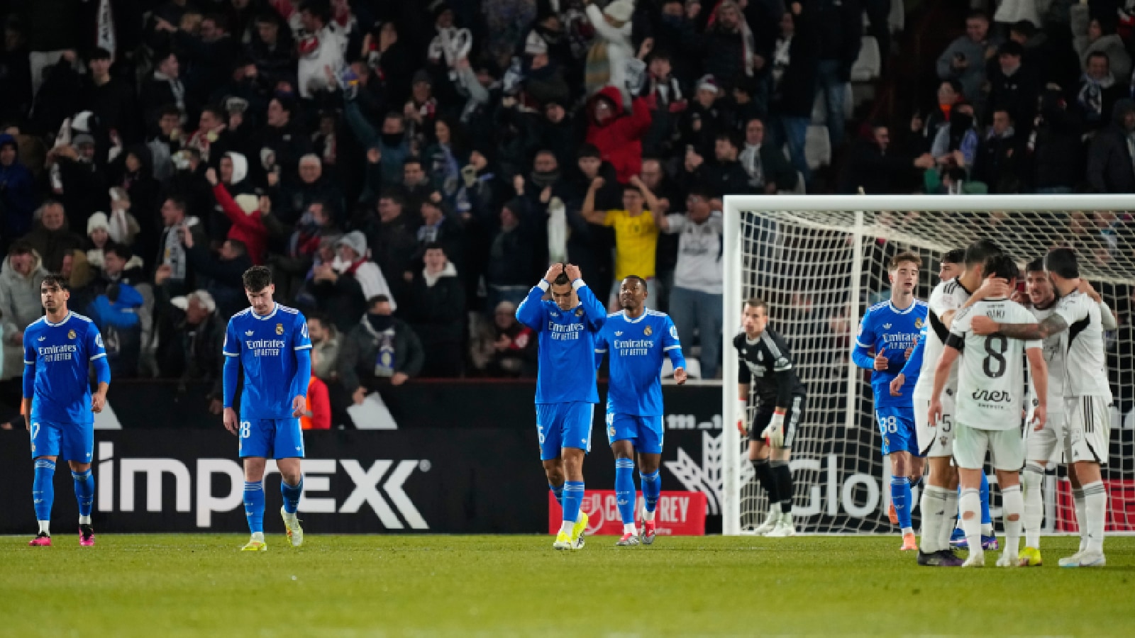 Real Madrid players react after Albacete scored its second goal during the Copa del Rey round of 16 soccer match between Albacete and Real Madrid, in Albacete. (AP Photo)