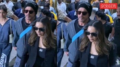 Shah Rukh Khan holds daughter Suhana's hand as they get out of crowded Mumbai airport