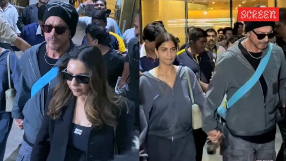 Shah Rukh Khan holds daughter Suhana's hand as they get out of crowded Mumbai airport