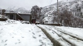 A view of a snow-covered path following a fresh spell of snowfall in Kotranka, Rajouri.