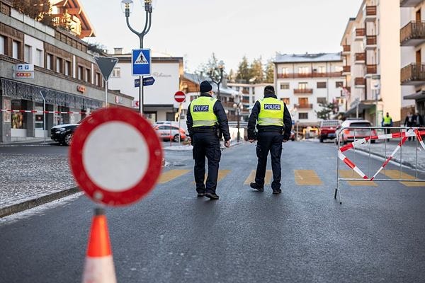 Police officers inspect the area where a fire broke out at the Le Constellation bar and lounge leaving people dead and injured, during New Year‚Äôs celebration, in Crans-Montana, Swiss Alps, Switzerland 