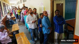 People wait in a queue to cast votes at Kroot school in Wanawadi on Thursday.