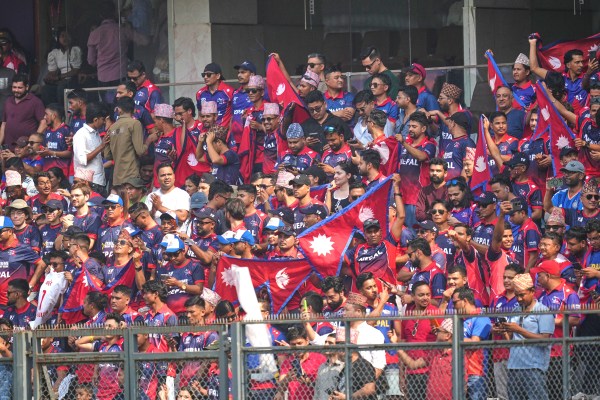 Nepal cricket team supporters cheer during the T20 World Cup match between England and Nepal in Mumbai. (AP Photo)