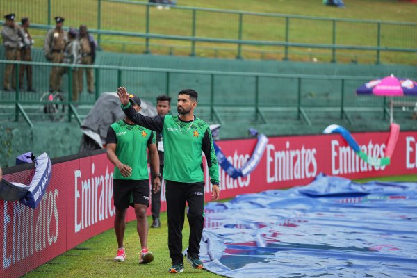 Zimbabwe's captain Sikandar Raza waves to the supporters as rain delayed the start of play during the T20 World Cup cricket match between Ireland and Zimbabwe in Pallekele, Sri Lanka, Tuesday, Feb. 17, 2026. (AP Photo/Eranga Jayawardena)