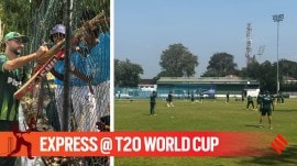 L-R: Pakistan's Abrar Ahmed signs autographs to young fans across the fence and Pakistan cricket team during a practice session in Colombo. (Express photo by Venkata Krishna B)