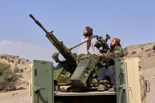 Taliban fighters look up while manning an armed pickup truck at the Afghan side of the Ghulam Khan crossing with Pakistan in Khost province. (AP/PTI)