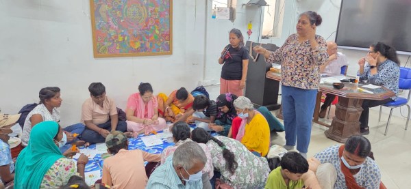 Patients and caregivers participate in an arts and crafts session at the CanSupport Center. 