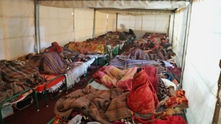 Cancer support: People resting in makeshift tents outside AIIMS Metro station, Gate no. 2. (Express Photo by Abhinav Saha)