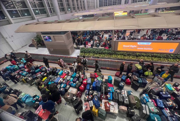 Passengers of cancelled flights searching for their baggages at terminal 1 of IGI airport followed by the indigo flight disruptions on Thursday night. Express Photographs by Arul Horizon, 05.12.2025, Pune *** Local Caption *** Passengers of cancelled flights searching for their baggages at terminal 1 of IGI airport followed by the indigo flight disruptions on Thursday night. Express Photographs by Arul Horizon, 05.12.2025, Pune