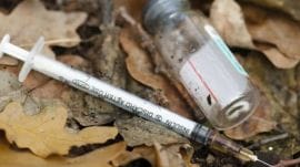A photo of syringe and drugs