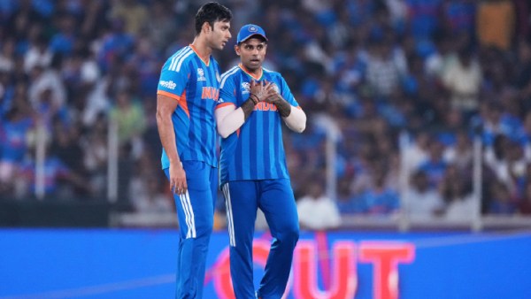 India's Shivam Dube, left, listens to captain Suryakumar Yadav as they celebrate the wicket of Netherlands' Colin Ackermann during the T20 World Cup cricket match between India and Netherlands in Ahmedabad, India, Wednesday, Feb. 18, 2026. (AP Photo/Ajit Solanki)