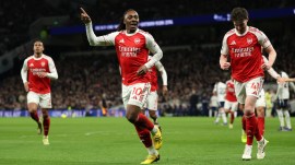 Arsenal's Eberechi Eze celebrates scoring his side's third goal during the English Premier League soccer match between Tottenham Hotspur and Arsenal in London. (AP Photo)