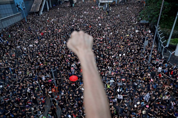 Protesters march on the streets against the extradition bill in Hong Kong in 2019. (AP Photo)