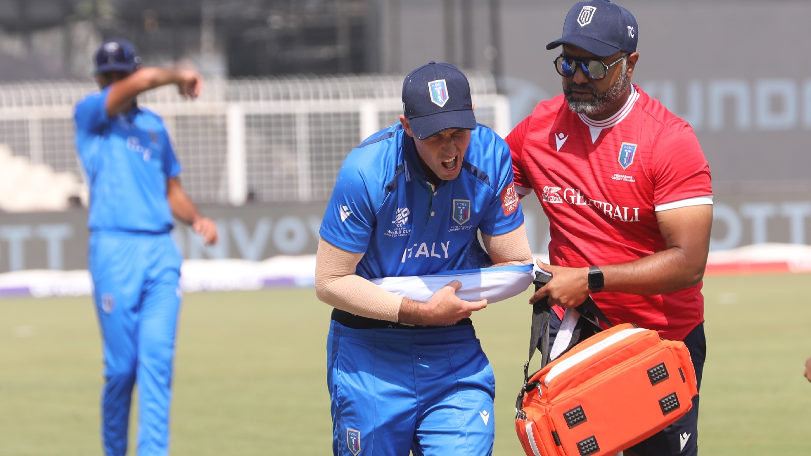 Captain of Italy, Wayne Madsen, leaves the  ground after his injury during the ICC T20 World Cup 2026 against Scotland. (Express photo by Partha Paul)
