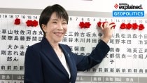 Sanae Takaichi, Japan's prime minister and president of the ruling Liberal Democratic Party (LDP), puts pins marking the names of candidates who won lower house elections on Sunday.