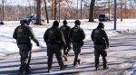 U.S. Border Patrol officers walk along a street in Minneapolis, Wednesday, Jan. 14, 2026. (AP Photo/Adam Gray,File)