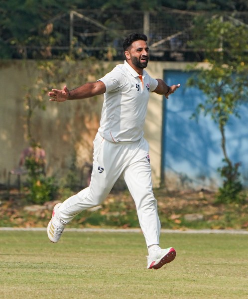 Jammu and Kashmir's Auqib Nabi celebrates after the wicket of Bengal's Suraj Sindhu Jaiswal during the third day of the Ranji Trophy semifinal at Bengal Cricket Academy Ground in Kalyani. (PHOTO: PTI) 