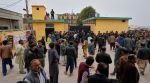 Pakistani security officers and rescue worker gather at the site of a bomb explosion at a Shiite mosque, in Islamabad, Pakistan. (AP Photo)