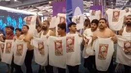 The protesters were purportedly wearing T-shirts with the Prime Minister’s picture printed on them, which they had concealed under their jackets and sweaters.