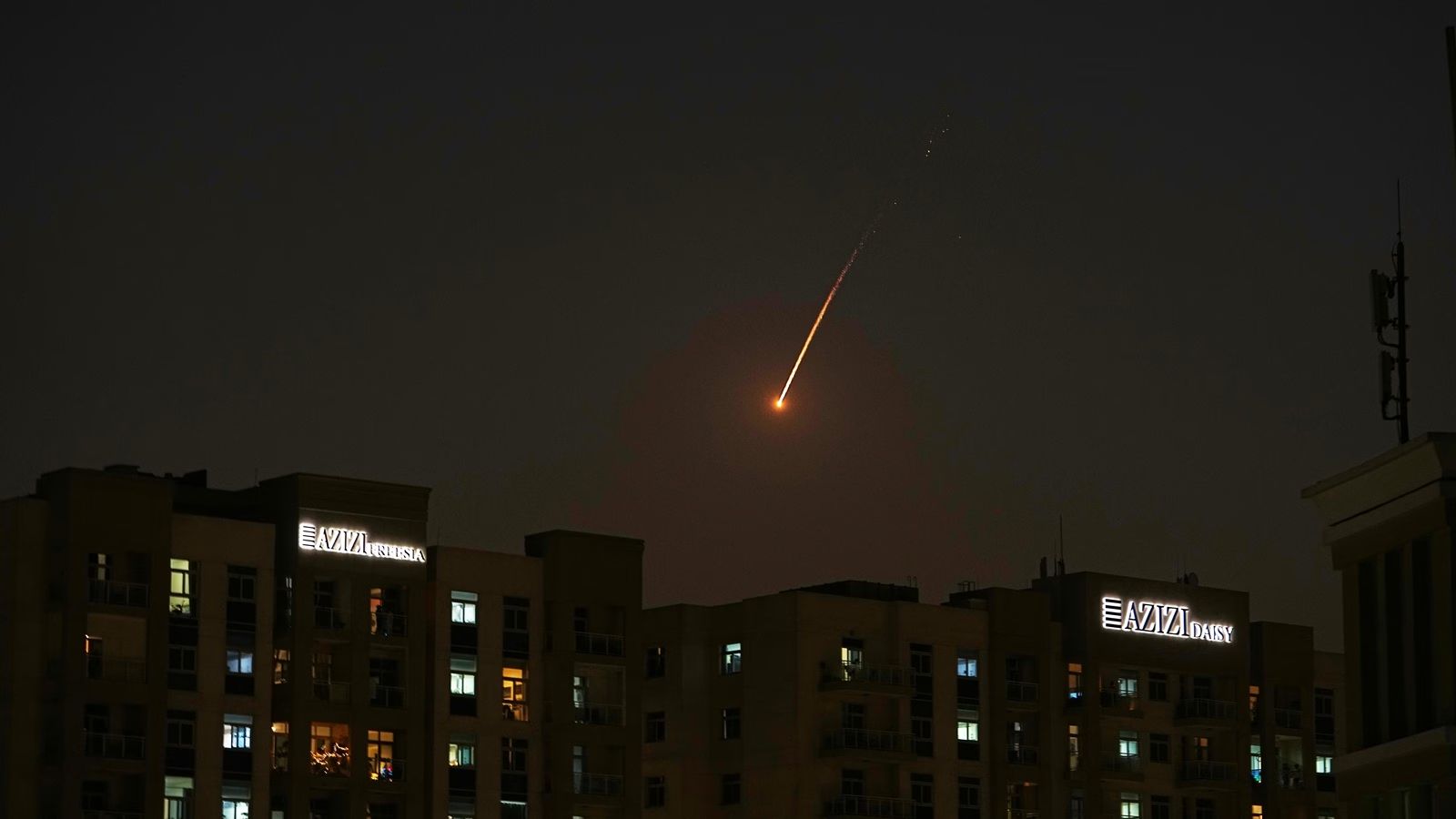 The flare of a projectile is seen over the skyline of Dubai, United Arab Emirates (Photo/AP)