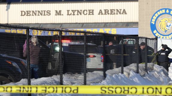 Police and ATF agents stand near the Lynch Arena in Pawtucket, R.I., after a shooting at the ice rink, Monday, Feb. 16. AP