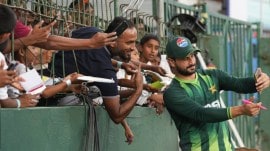 Pakistan's Sahibzada Farhan takes picture with his supporters before the start of the T20 World Cup match between Pakistan and US in Colombo, Sri Lanka, Tuesday, Feb. 10, 2026. (AP Photo)