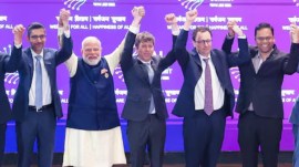 Sam Altman and Dario Amodei raising hands with Modi
