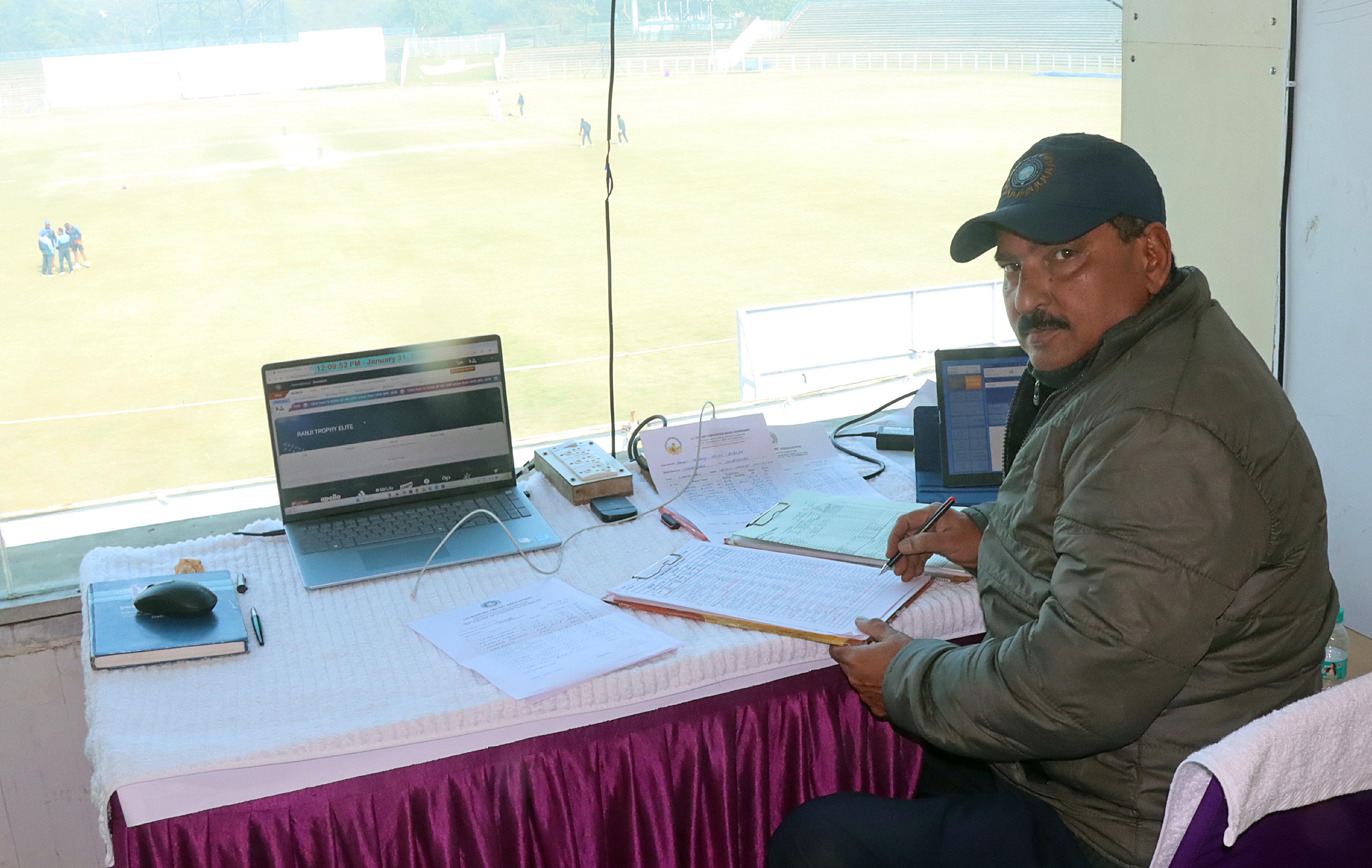 Scorer Sushil Diwan during Ranji Trophy match played at Sector 16 Cricket Stadium in Chandigarh. (Express Photo by Kamleshwar Singh)